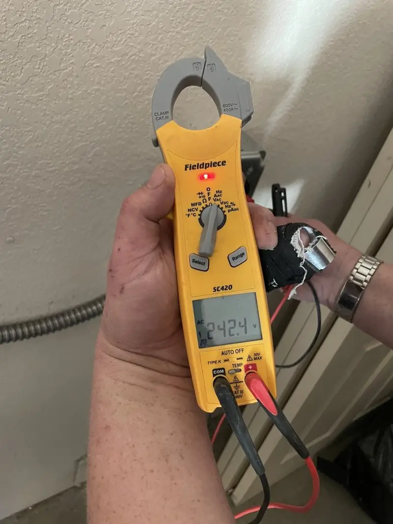 Voltage testing with clamp meter during Electrical Installation Services in DuBois